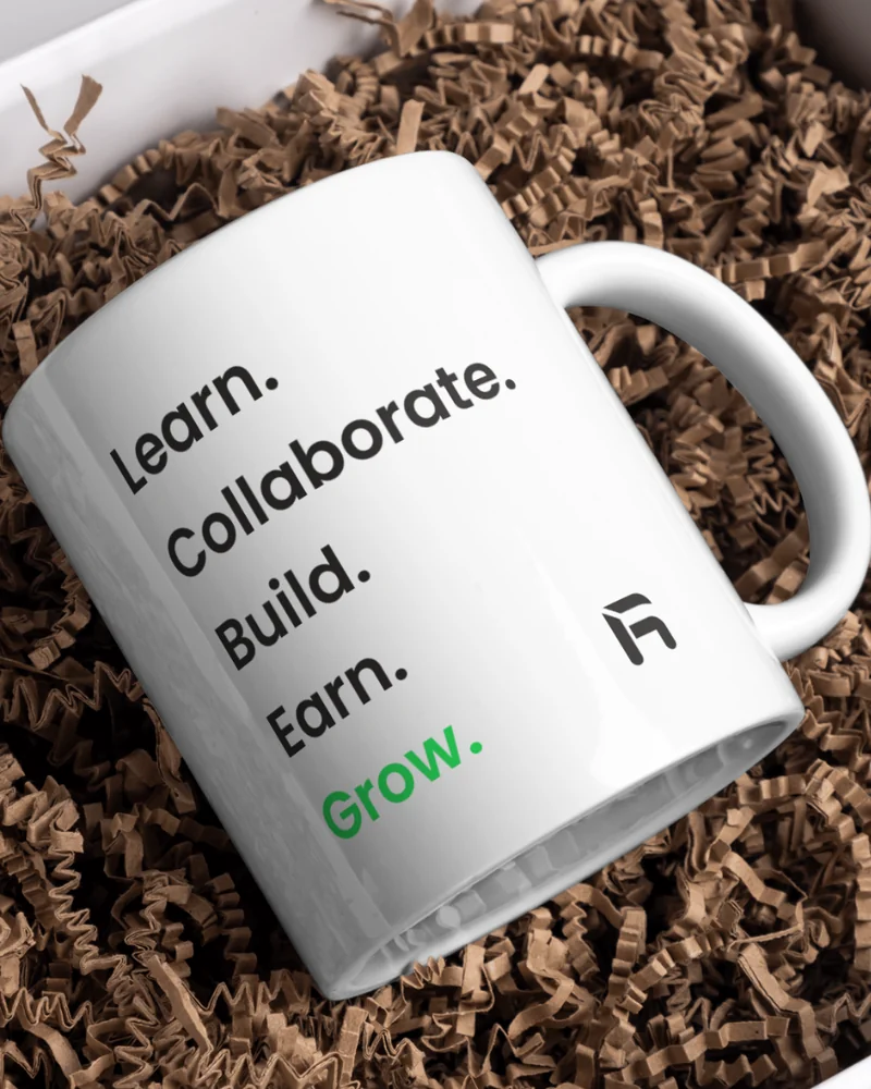 White ceramic mug printed with the manifesto, with the hex mark beside the handle